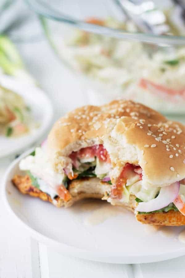 grilled spicy chicken sandwich with bite out of it