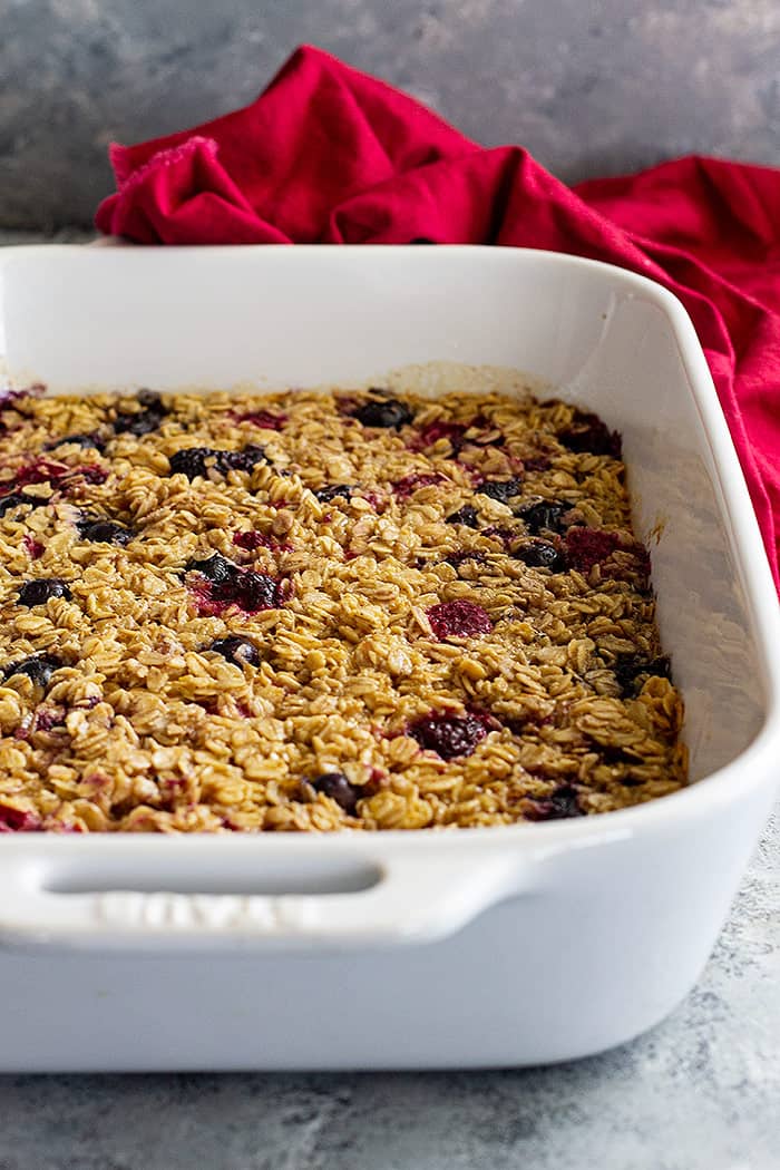 Baked oatmeal in a white 9x13 baking dish fresh from the oven. 