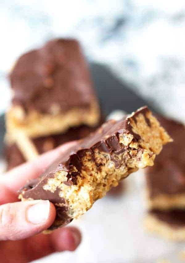 Peanut Butter Cup Rice Krispie Treats -peanut butter flavored rice krispies, studded with mini peanut butter cups, topped with a peanut butter chocolate topping! | www.countrysidecravings.com