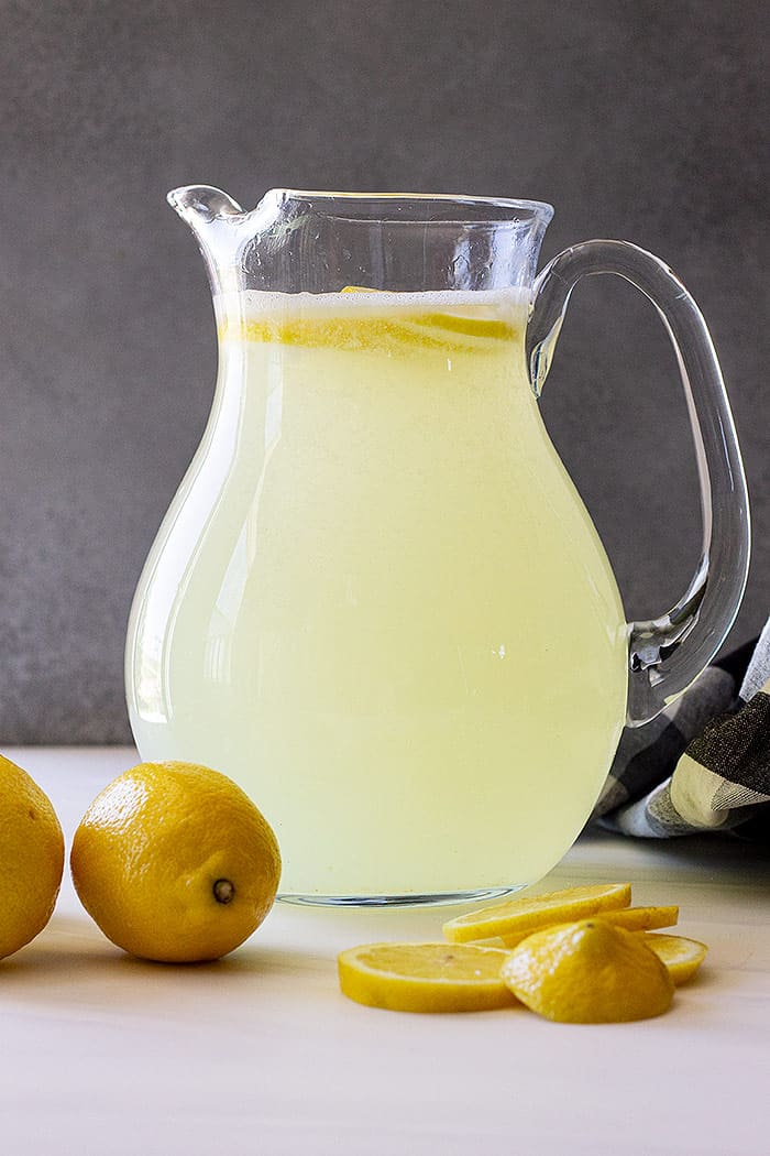 A pitcher of freshly made lemonade.