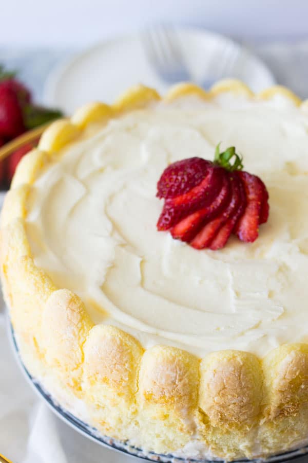 Ladyfinger Strawberry Ice Cream Cake -an easy and eye catching dessert. Layered with strawberry ice cream, luscious strawberries and topped with freshly whipped cream! | www.countrysidecravings.com 