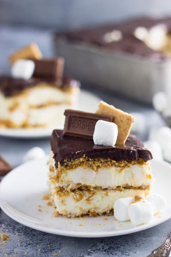 An easy S'mores Ice Box Cake recipe made with graham crackers, marshmallow filling and topped with chocolate ganache! | www.countrysidecravings.com