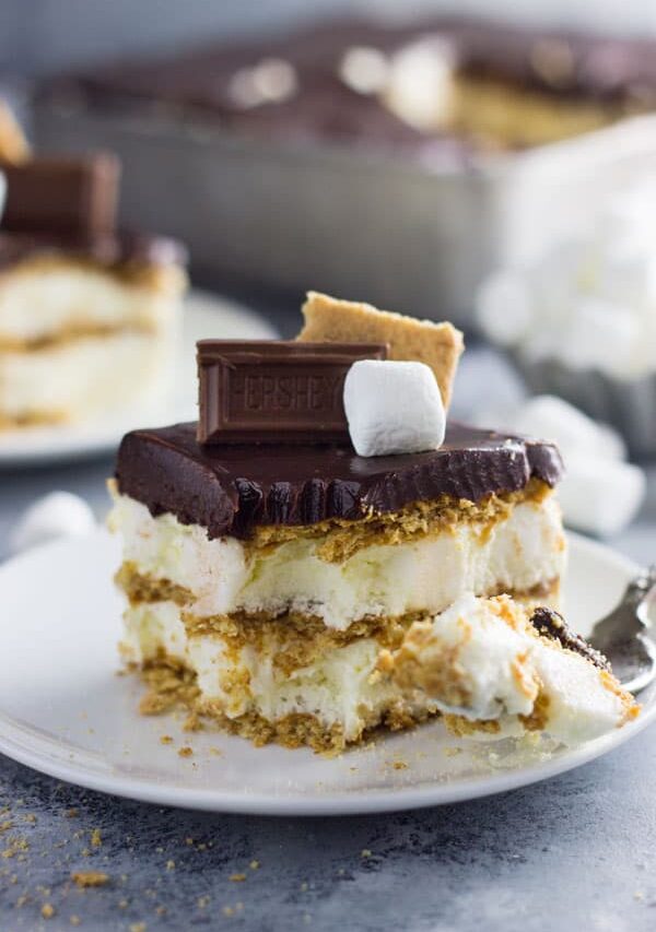 An easy S'mores Ice Box Cake recipe made with graham crackers, marshmallow filling and topped with chocolate ganache! | www.countrysidecravings.com