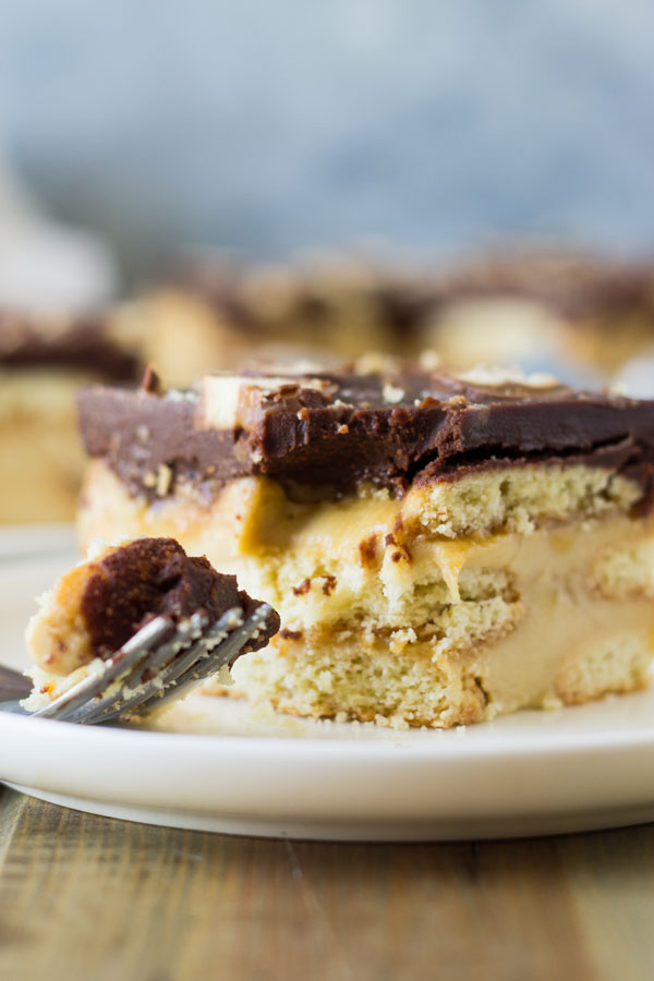This Twix Icebox Cake is an easy and decadent no-bake cake. Made with homemade pudding, shortbread cookies, caramel and chocolate! | www.countrysidecravings.com