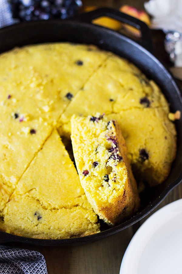 Blueberry Peach Cornbread made with buttermilk, studded with fresh blueberries and peaches will be your new favorite breakfast treat! | www.countrysidecravings.com