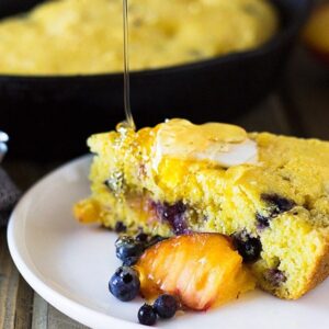 Blueberry Peach Cornbread made with buttermilk, studded with fresh blueberries and peaches will be your new favorite breakfast treat! | www.countrysidecravings.com