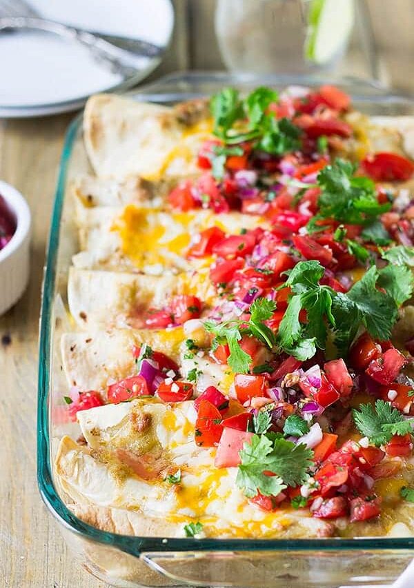 Breakfast Enchiladas are filled with scrambled eggs, sausage, green chilies and cheese! Perfect for weekend breakfast or brunch! | www.countrysidecravings.com