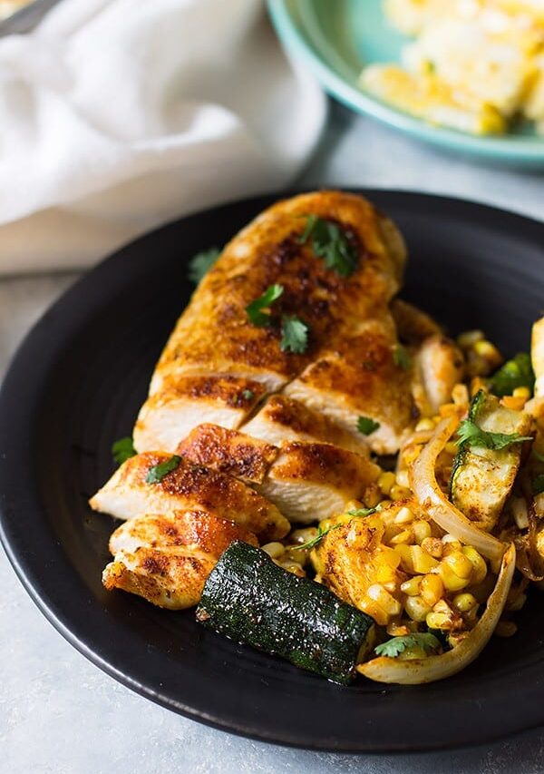 Easy Sheet Pan Mexican Chicken and Vegetables made with fresh corn, zucchini, onion, seasoned to perfection and done in 30 minutes! | www.countrysidecravings.com