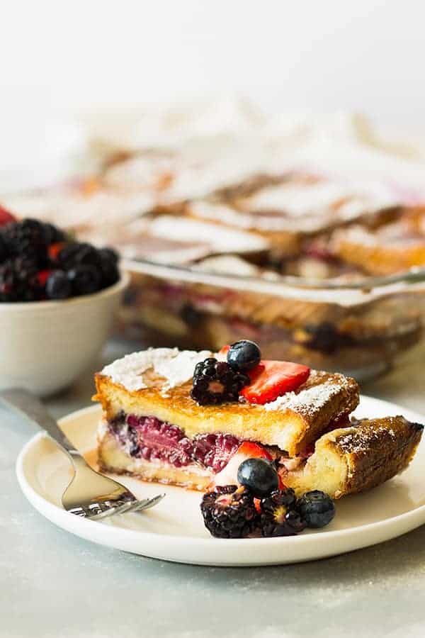 Triple Berry French Toast Casserole -an easy yet impressive breakfast casserole. Layered with thick texas toast, cream cheese, fresh berries and an egg custard! | www.countrysidecravings.com