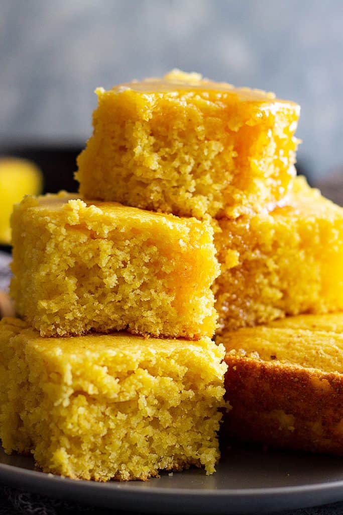 This Buttermilk Cornbread recipe is the best cornbread ever!! Choose to make it sweet or savory by adjusting the sugar. It has a tender moist crumb and is perfect drizzled with honey! #cornbread #easyrecipe #sweetcornbread