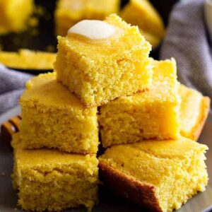 This Buttermilk Cornbread recipe is the best cornbread ever!! Choose to make it sweet or savory by adjusting the sugar. It has a tender moist crumb and is perfect drizzled with honey! #cornbread #easyrecipe #sweetcornbread