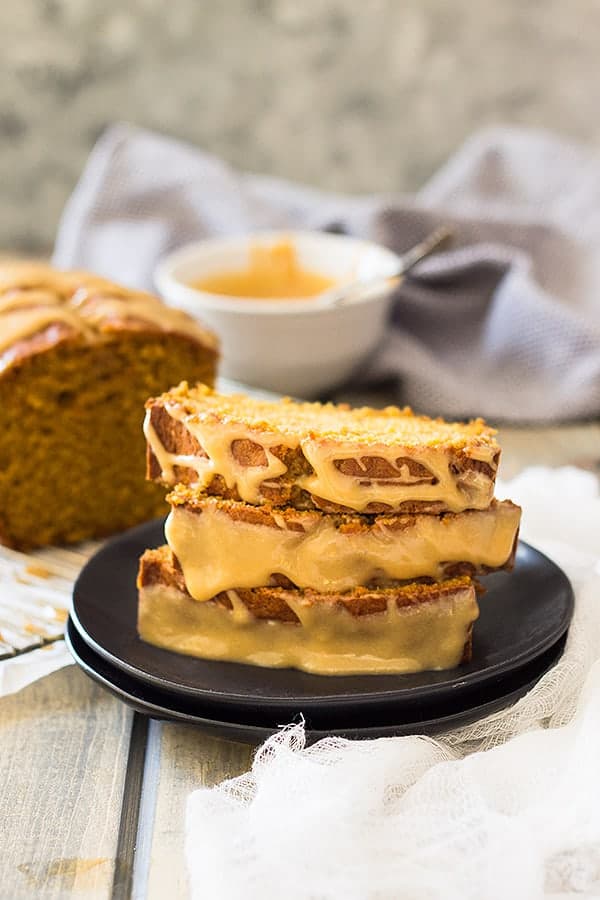 This Pumpkin Bread with Cream Cheese Caramel Icing is super easy to make! It's moist, tender, full of pumpkin and spice. But the best part is the super easy cream cheese caramel icing!! | www.countrysidecravings.com