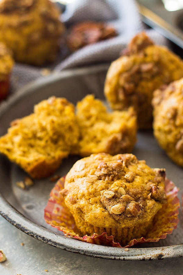 These Pumpkin Streusel Muffins are the perfect fall breakfast or snack! They are perfectly moist, full of pumpkin flavor, spiced perfectly and topped with a crunchy streusel topping! | www.countrysidecravings.com