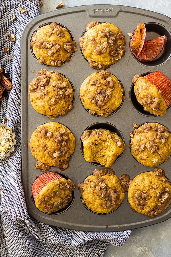 These Pumpkin Streusel Muffins are the perfect fall breakfast or snack! They are perfectly moist, full of pumpkin flavor, spiced perfectly and topped with a crunchy streusel topping! | www.countrysidecravings.com