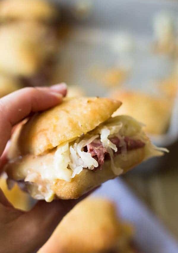 These easy Reuben Sliders make a great appetizer, snack or meal! Piled high with all the fixings they will definitely be a hit! | www.countrysidecravings.com