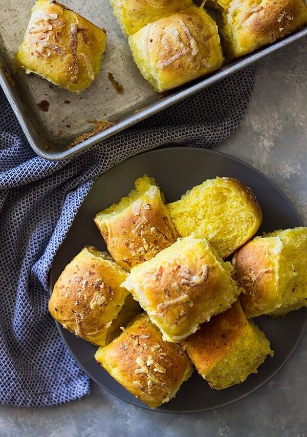 These Savory Pumpkin Rolls will be a great addition to your dinner table. Fluffy light biscuits made with pumpkin, rosemary and Parmesan cheese. | www.countrysidecravings.com