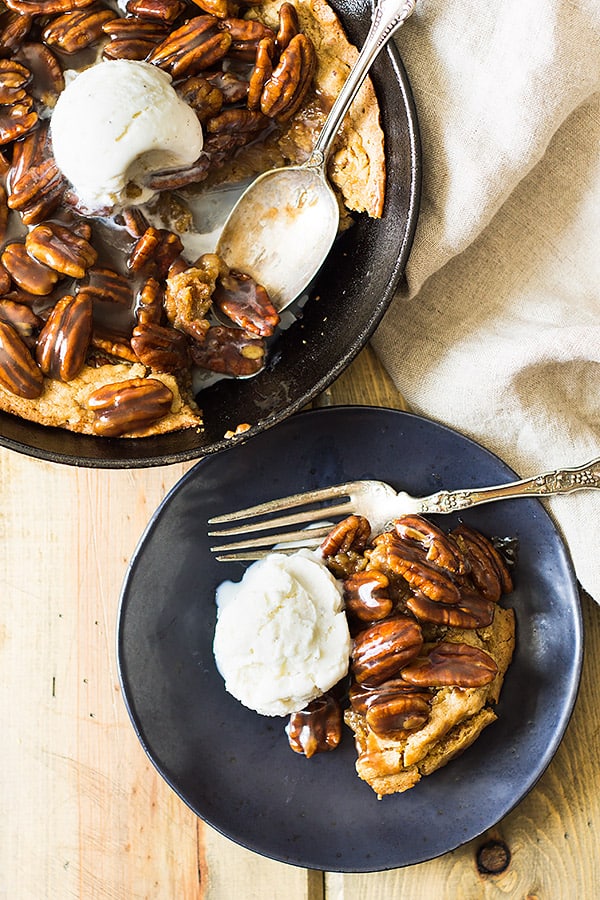 This easy Skillet Blondie with Bourbon Caramel Pecans is thick and chewy, studded with pecans, then topped with the most luscious bourbon caramel! | www.countrysidecravings.com
