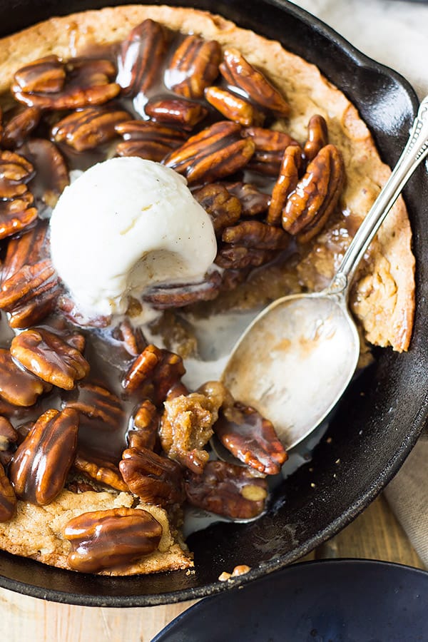 This easy Skillet Blondie with Bourbon Caramel Pecans is thick and chewy, studded with pecans, then topped with the most luscious bourbon caramel! | www.countrysidecravings.com