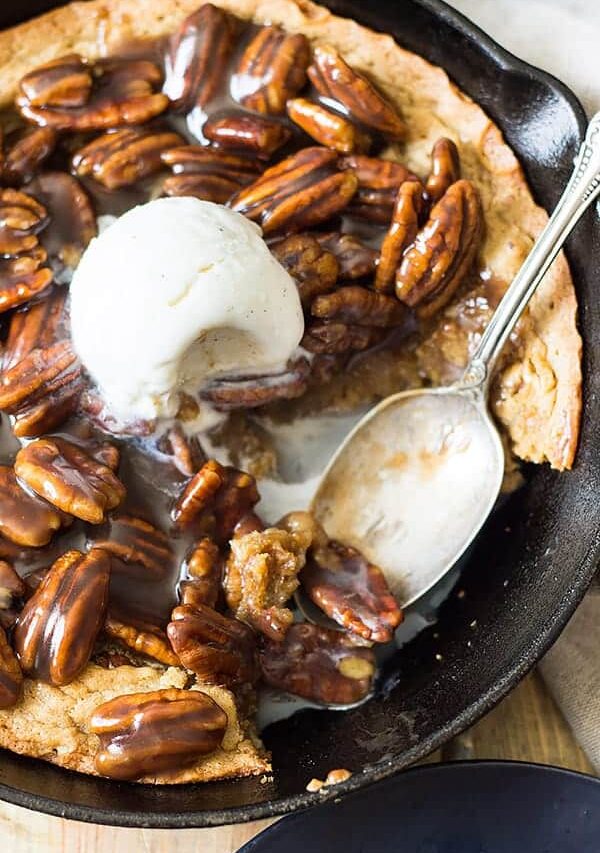 This easy Skillet Blondie with Bourbon Caramel Pecans is thick and chewy, studded with pecans, then topped with the most luscious bourbon caramel! | www.countrysidecravings.com