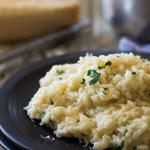 This Easy Parmesan Risotto has been simplified with the help from America's Test Kitchen. Less stirring, less work but creamy, dreamy risotto!!