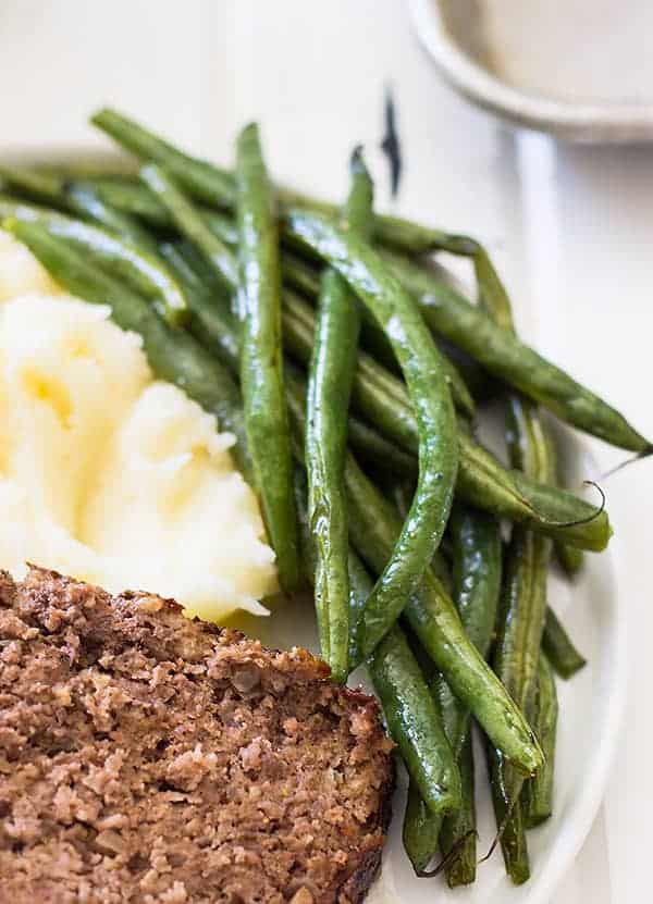 plate with green beans and mashed potatoes
