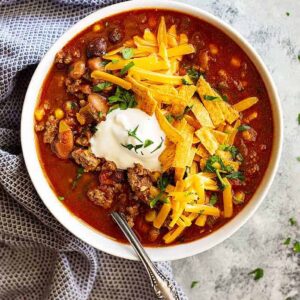 This Easy Taco Soup is big on flavor, hearty, and only takes 30 minutes to make! Or make it in the slow cooker and come home to a delicious meal! #soup #easy #healthy #taco