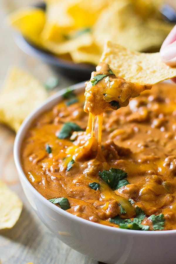 This Homemade Chili Cheese Dip contains no processed cheese and no canned chili, just simple homemade goodness right in the slow cooker!! | www.countrysidecravings.com