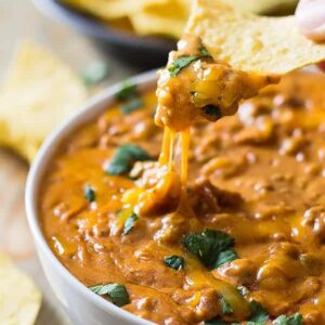 This Homemade Chili Cheese Dip contains no processed cheese and no canned chili, just simple homemade goodness right in the slow cooker!! | www.countrysidecravings.com