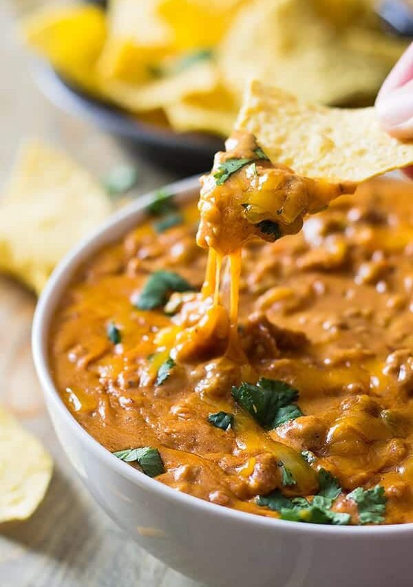 This Homemade Chili Cheese Dip contains no processed cheese and no canned chili, just simple homemade goodness right in the slow cooker!! | www.countrysidecravings.com