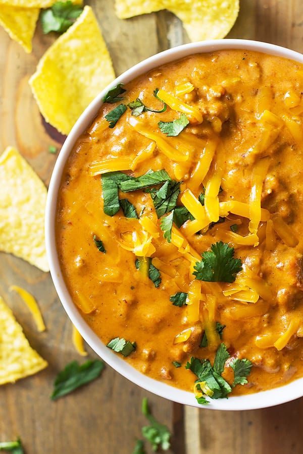 This Homemade Chili Cheese Dip contains no processed cheese and no canned chili, just simple homemade goodness right in the slow cooker!! | www.countrysidecravings.com