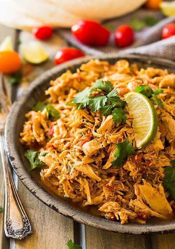 This easy Slow Cooker Shredded Mexican Chicken is a great base recipe to use for tacos, enchiladas, nachos, burritos, salads or just serve it over rice. | www.countrysidecravings.com