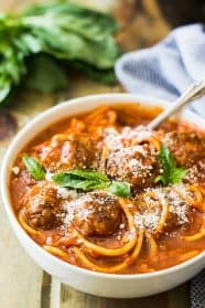 This Slow Cooker Spaghetti Meatball Soup is pure comfort food! A wonderful tomato soup filled with flavorful meatballs and tender spaghetti! | www.countrysidecravings.com