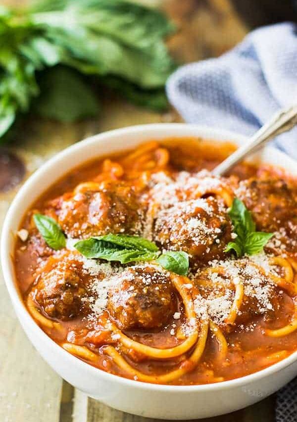 This Slow Cooker Spaghetti Meatball Soup is pure comfort food! A wonderful tomato soup filled with flavorful meatballs and tender spaghetti! | www.countrysidecravings.com