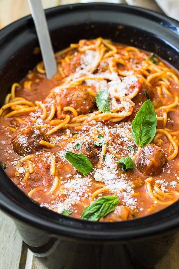 This Slow Cooker Spaghetti Meatball Soup is pure comfort food! A wonderful tomato soup filled with flavorful meatballs and tender spaghetti! | www.countrysidecravings.com