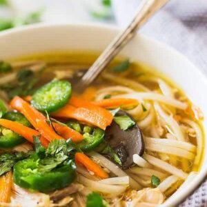 This Slow Cooker Asian Chicken Noodle Soup puts a twist on the classic. With a flavorful broth, mushrooms, ginger, garlic and noodles! | www.countrysidecravings.com