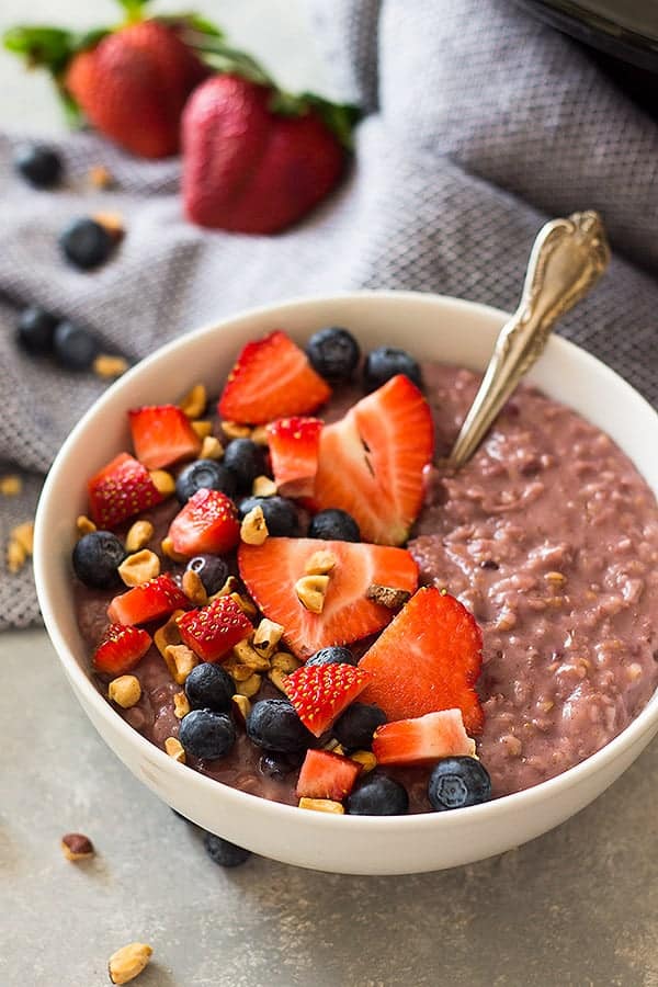 Slow Cooker Berry Oatmeal is a wonderfully hearty breakfast using steel cut oats, frozen mixed berries and your trusty crockpot! | www.countrysidecravings.com