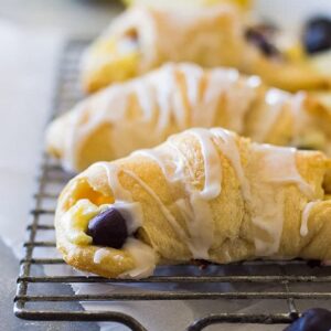 These Lemon Blueberry Cheesecake Crescent rolls is an easy recipe using store bought crescent dough. Combine that with lemon and blueberries and you have one sweet treat!