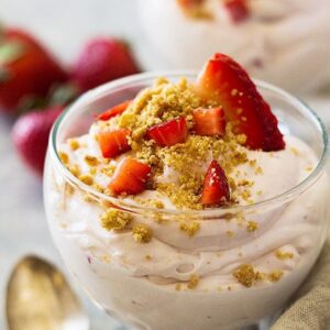 This Strawberry Cheesecake Fluff is a super simple and easy dessert to make. It's light and creamy, filled with strawberries and sprinkled with a graham cracker topping.
