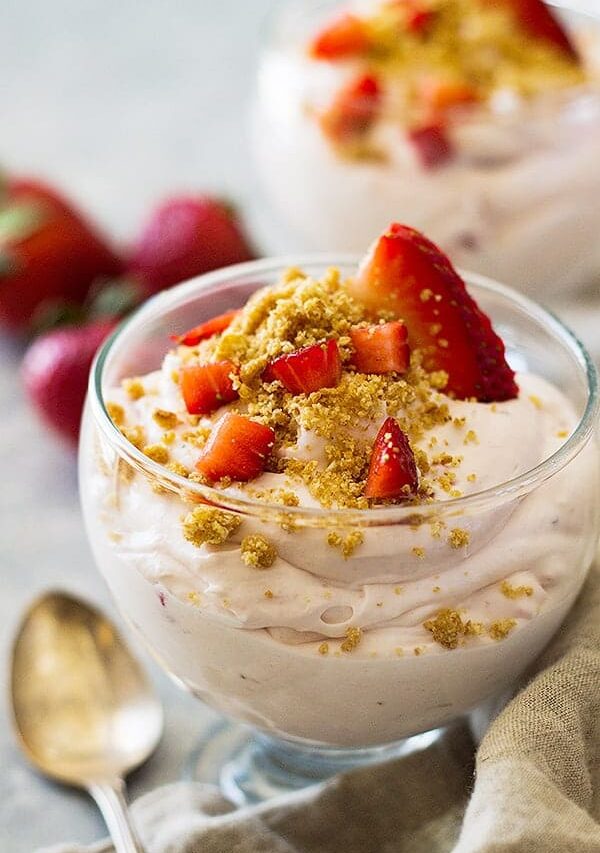 This Strawberry Cheesecake Fluff is a super simple and easy dessert to make. It's light and creamy, filled with strawberries and sprinkled with a graham cracker topping.