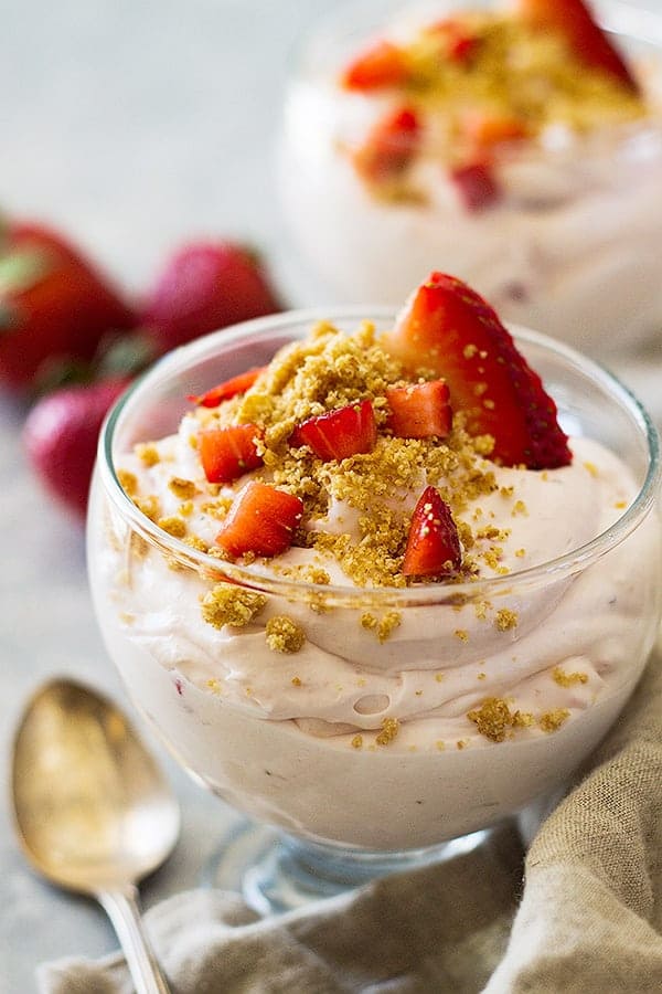 Front view of strawberry cheesecake fluff with strawberries.