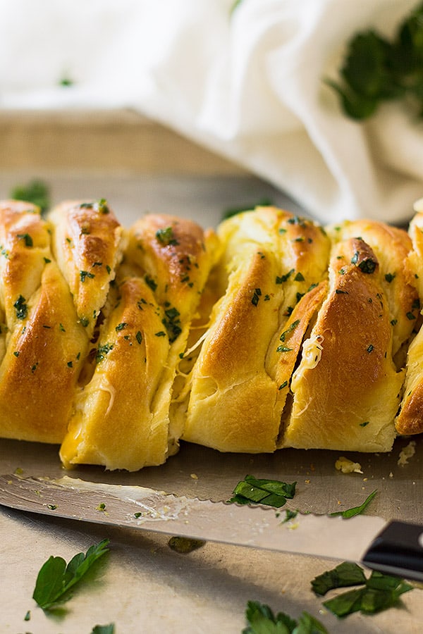 This Three Cheese Braid is a great appetizer. It's filled with melty cheese and brushed with melted butter and garlic. 