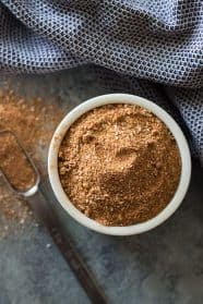 Dry rub recipe in white bowl with scoop