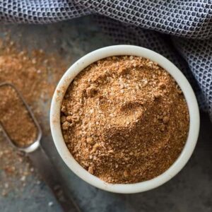 Dry rub recipe in white bowl with scoop
