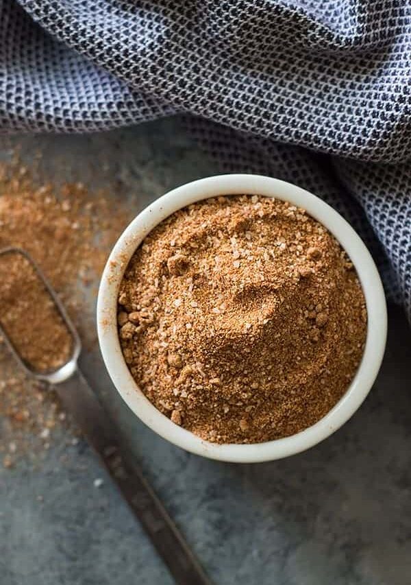 Dry rub recipe in white bowl with scoop