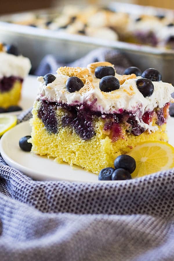 Lemon Poke Cake with Blueberry Sauce - Countryside Cravings