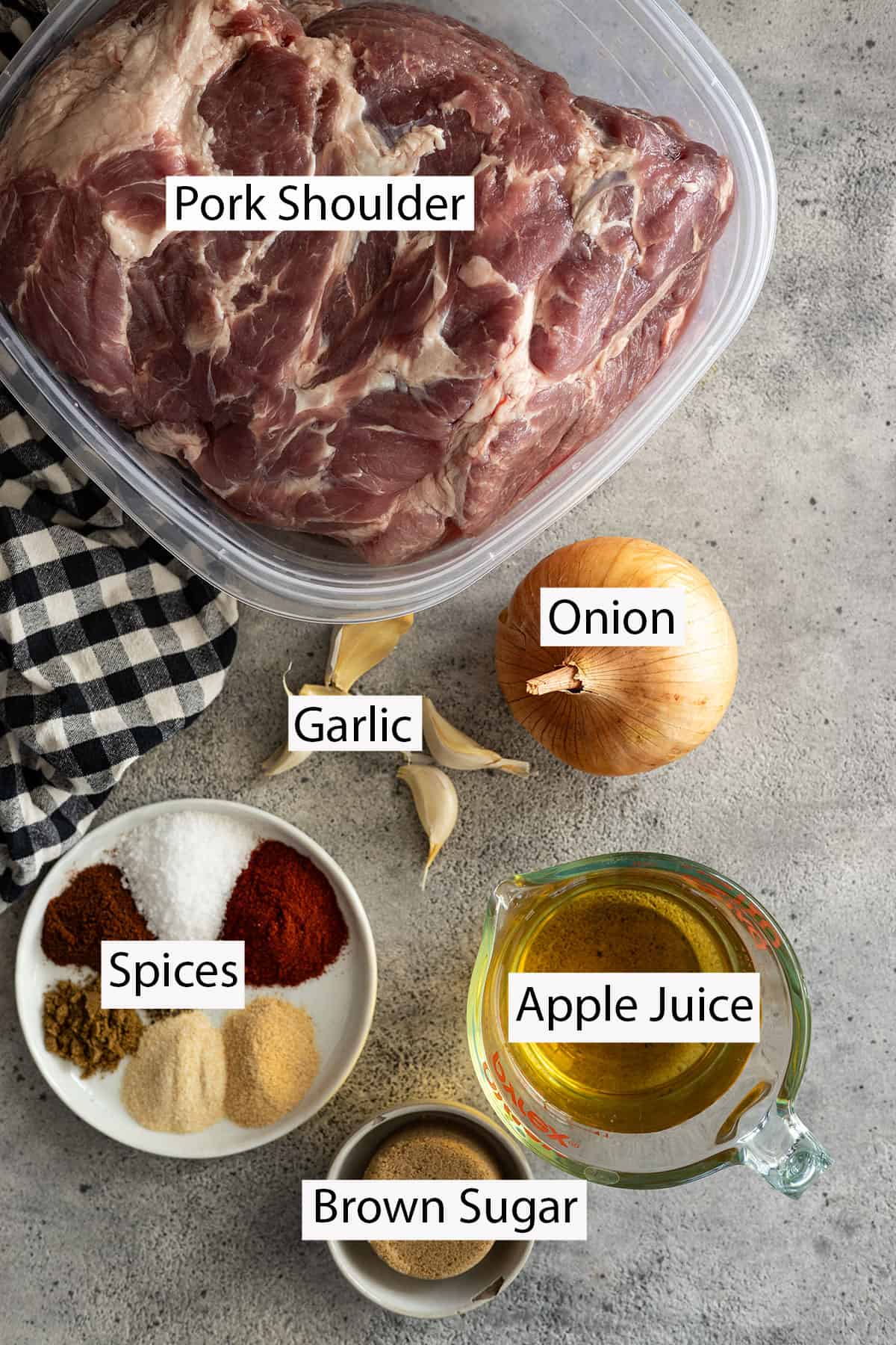 Ingredients: pork shoulder, onion, garlic, apple juice, brown sugar, and spices. 