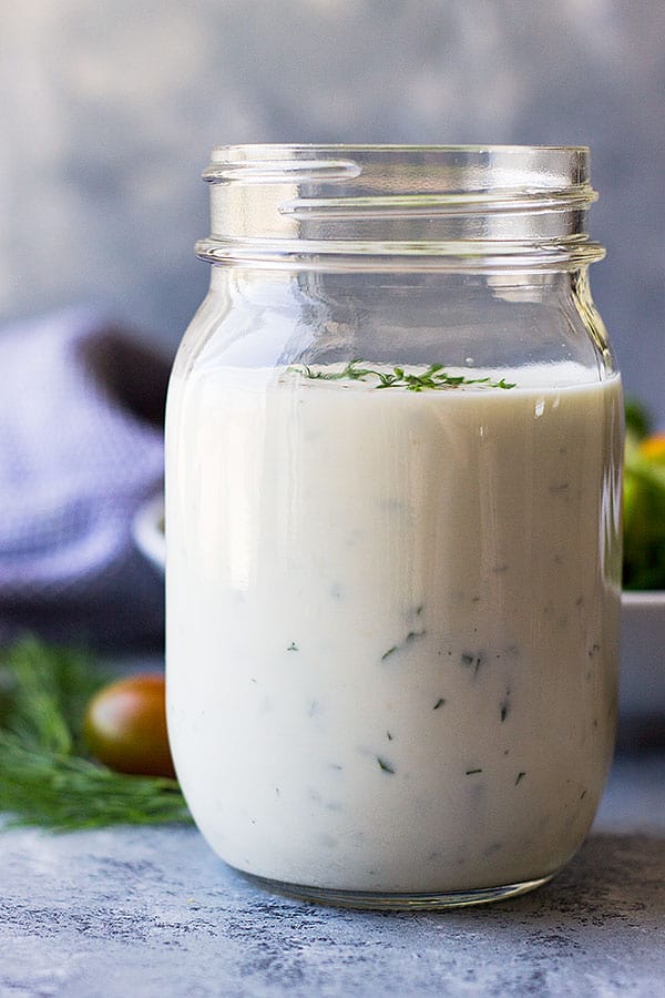 This Homemade Buttermilk Ranch Dressing is an easy recipe to replace those store bought bottles! It's fresh, creamy and perfect for any salad! 
