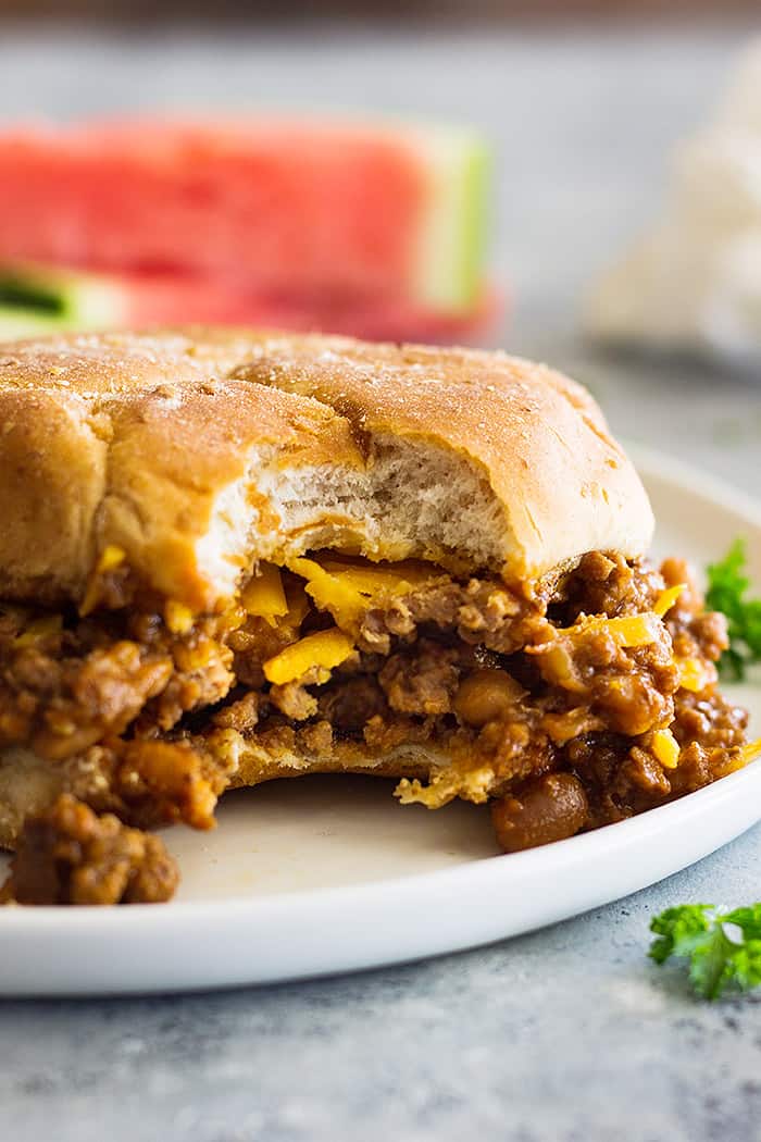 close up shot of slow cooker beef and bean sloppy joes on white plate