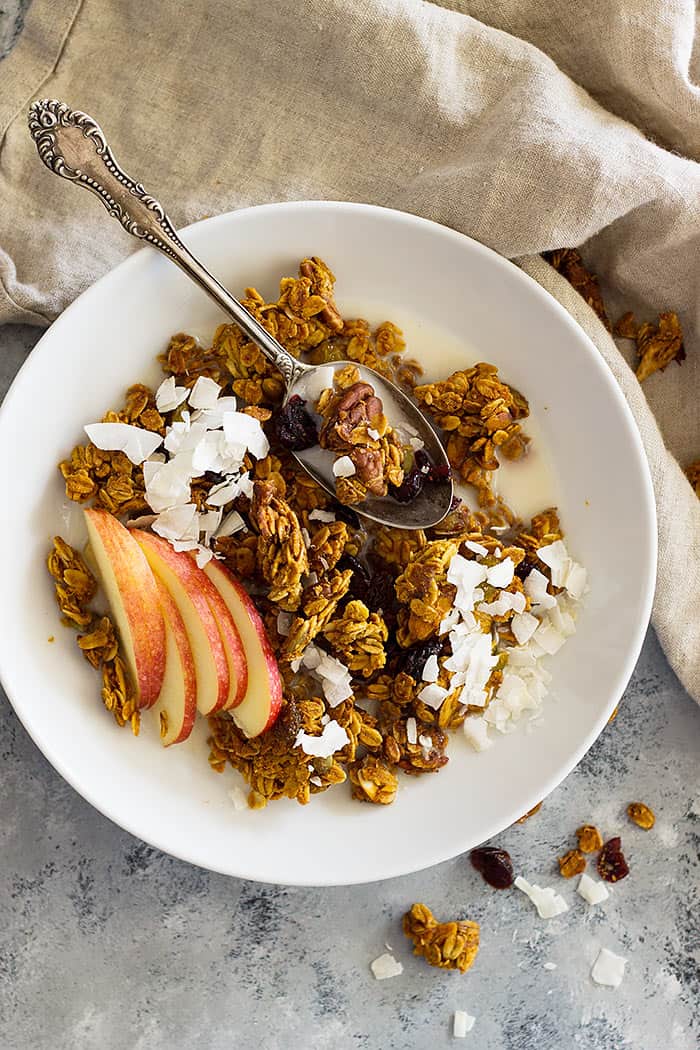 This healthy Crunchy Pumpkin Granola is naturally sweetened and made with real pumpkin. It's easy to make and is great for breakfast!