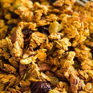 This easy and healthy Crunchy Pumpkin Granola is made with real pumpkin! It has tons of fall goodies like pecans, pumpkin spice and pumpkin seeds!